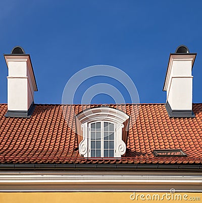 Oldgarret roof with window and chimneys. Retro attic window and fireplace chimneys, Stock Photo