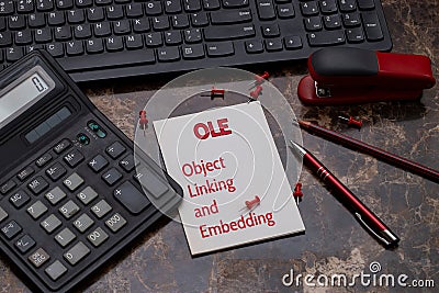 OLE, OBJECT LINKING AND EMBEDDING written on a reminder sheet Stock Photo