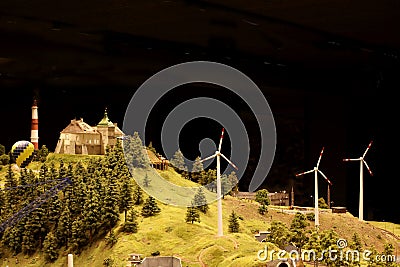 Olesky castle and wind power generators near it in Ukraine. Landscape layout with railroad, cars, residential and industrial Editorial Stock Photo