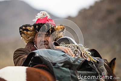 Local mongolian people during annual national competition with birds of prey BERKUTCHI of West Mongolia Editorial Stock Photo