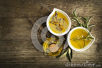 Olive oil with herbs Stock Photo