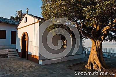 Olive tree and the church of Agios Ioannis Kastri at sunset, famous from Mamma Mia movie scenes, Skopelos Island Stock Photo