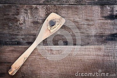 Olive Wood Spatula over Wooden Background Stock Photo