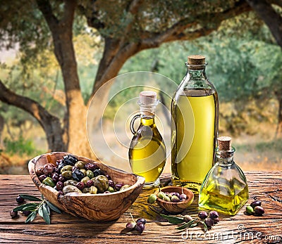 Olives and olive oil in a bottle. Stock Photo