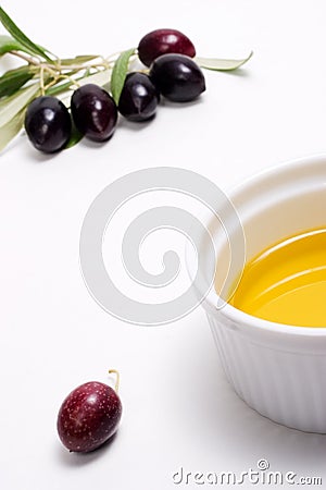 Olives twig with container olive oil Stock Photo