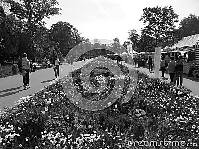 Blackwhite image - Main street at Flora Exposition with many tourists and long flowerbed in the middle with multiple species of va Editorial Stock Photo