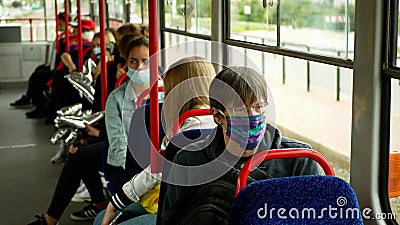 OLOMOUC, CZECH REPUBLIC, JUNE 22, 2020: Coronavirus mask face tram streetcar drive crowd people passengers, public Editorial Stock Photo