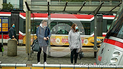 PRAGUE, CZECH REPUBLIC, JUNE 22, 2020: Coronavirus mask without face tram streetcar stop tram crowd people passengers Editorial Stock Photo