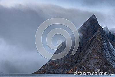 Olstinden mountain peak in Skandia..It is located on the shore of Kjerkfjorden Stock Photo