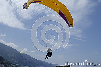 Oludeniz Beach, which is famous for its sandy beach and blue sea, is where paragliders jumping from Babadag land. Editorial Stock Photo
