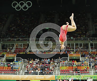 Olympic champion Aly Raisman of United States competes on the balance beam at women`s all-around gymnastics at Rio 2016 Olympics Editorial Stock Photo