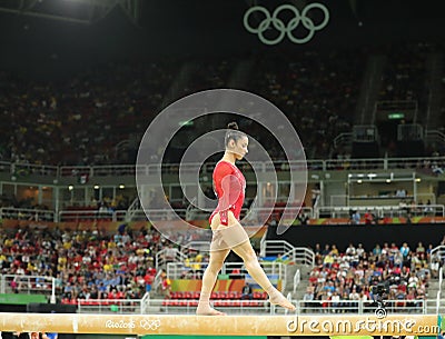 Olympic champion Aly Raisman of United States competes on the balance beam at women`s all-around gymnastics at Rio 2016 Olympics Editorial Stock Photo