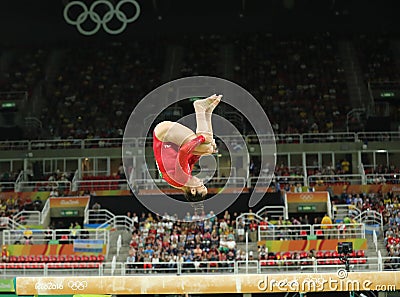 Olympic champion Aly Raisman of United States competes on the balance beam at women`s all-around gymnastics at Rio 2016 Olympics Editorial Stock Photo