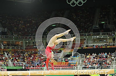 Olympic champion Aly Raisman of United States competes on the balance beam at women`s all-around gymnastics at Rio 2016 Olympics Editorial Stock Photo