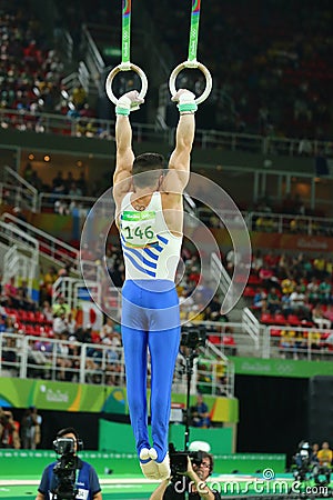 Olympic champion Eleftherios Petrounias of Greece competes at the Men`s Rings Final on artistic gymnastics competition at Rio Editorial Stock Photo