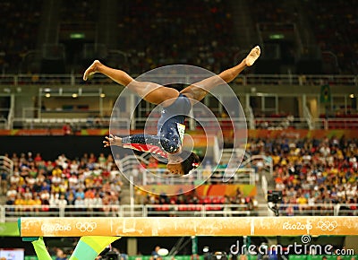 Olympic champion Simone Biles of United States competing on the balance beam at women's all-around gymnastics qualification Editorial Stock Photo