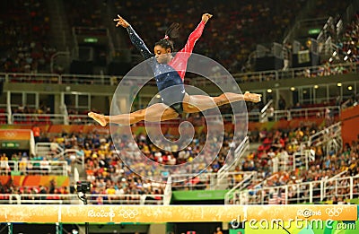 Olympic champion Simone Biles of United States competing on the balance beam at women's all-around gymnastics qualification Editorial Stock Photo