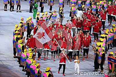 Olympic champion trampoline gymnast Rosie MacLennan carrying Canadian flag leading the Olympic team Canada in the Rio 2016 Opening Editorial Stock Photo