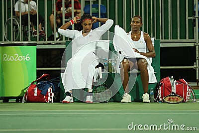 Olympic champions Serena and Venus Williams of USA in action during doubles first round match of the Rio 2016 Olympic Games Editorial Stock Photo