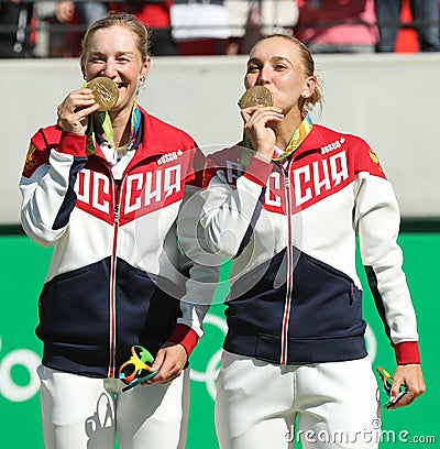 Olympic champions team Russia Ekaterina Makarova (L) and Elena Vesnina during medal ceremony after tennis doubles final Editorial Stock Photo