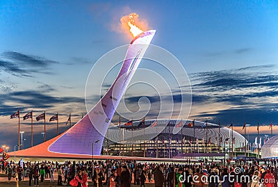 The Olympic Torch erection with the burning flame in the Olympic Park was the main venue of the Sochi Winter Olympics in 2014 Editorial Stock Photo