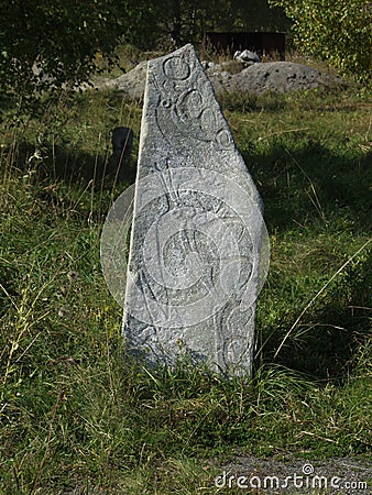 Petroglyphs - ancient writing on stones Stock Photo