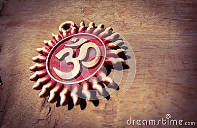 Om pendent on wood background and greeting Stock Photo