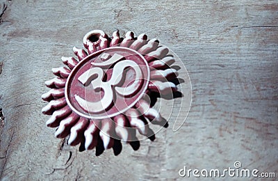 Om pendent on wood background and greeting Stock Photo