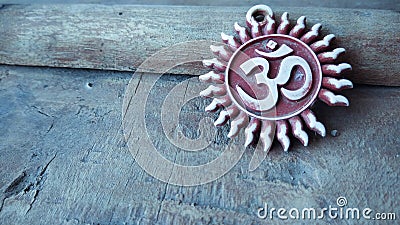 Om pendent on wood background and greeting Stock Photo