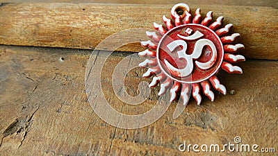 Om pendent on wood background and greeting Stock Photo