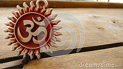 Om pendent on wood background and greeting Stock Photo