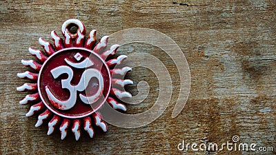 Om pendent on wood background and greeting Stock Photo