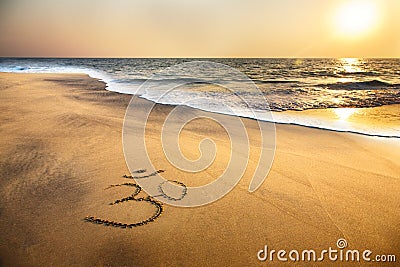 Om symbol on the beach Stock Photo