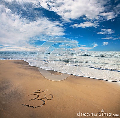 Om symbol on the beach Stock Photo