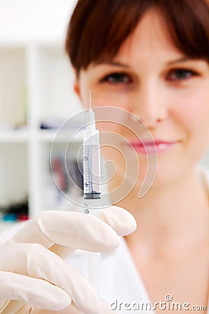 Oman doctor with a syringe in hand Stock Photo