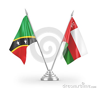 Oman and Saint Kitts and Nevis table flags isolated on white 3D rendering Stock Photo