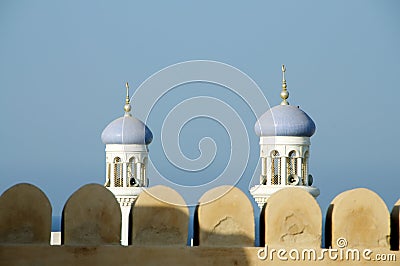 Omani fort and minarets Stock Photo