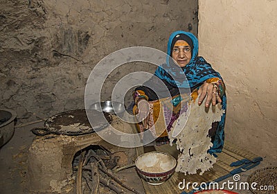 Omani lady making local bread Editorial Stock Photo