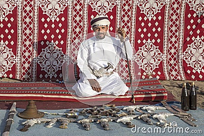 Omani man selling traditional khanjar daggers Editorial Stock Photo