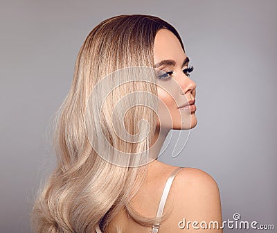 Ombre blond shiny hair. Beauty fashion blonde woman portrait. Beautiful girl model with makeup, long healthy hairstyle posing Stock Photo