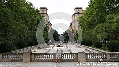 An ombre looks at the empty fountain of the monument of the fallen in Carlos III Pamplona Navarra Editorial Stock Photo