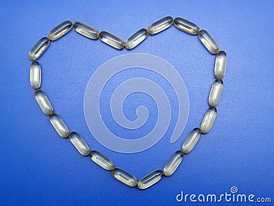 Omega 3 capsules heart shape Stock Photo