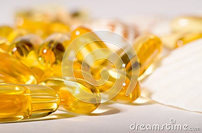 Omega 3 capsules. Supplement food capsules with oil of nordic fish oil. Vitamins and tablets against white Stock Photo