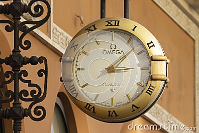 Omega clock on the wall of a building on Nevsky Prospekt in St. Petersburg Editorial Stock Photo