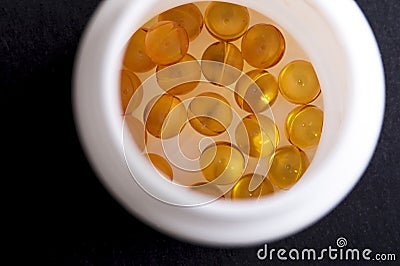 Omega fish oil capsules in bottle Stock Photo