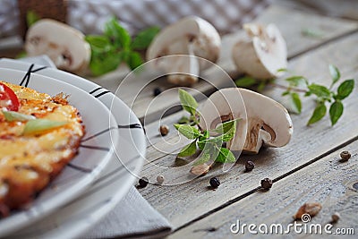 Omelet with onion, tomatoes and mushrooms Stock Photo