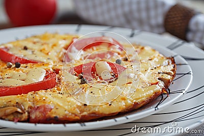 Omelet with onion, tomatoes and mushrooms Stock Photo