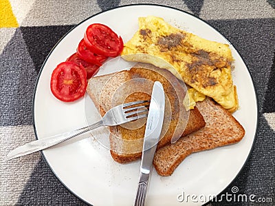 omelete with baked bread Stock Photo