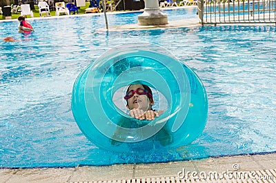 Omer, ISRAEL -June 27,Boy in an inflatable pool with a blue circle - Omer, Negev, June 27, 2015 in Israel Editorial Stock Photo