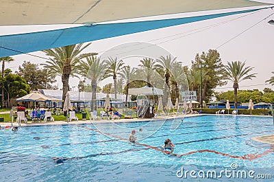 Omer, ISRAEL -June 27,People swim in the outdoor pool- Omer, Negev, June 27, 2015 in Israel Editorial Stock Photo
